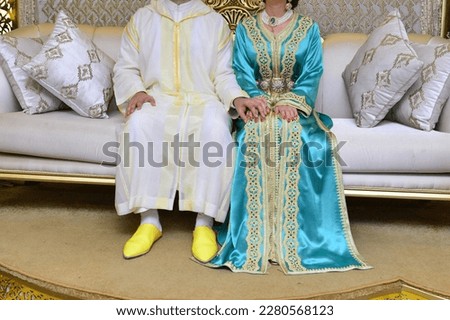 Moroccan bride and groom. The bride wears the Moroccan caftan and the groom wears the Moroccan djellaba