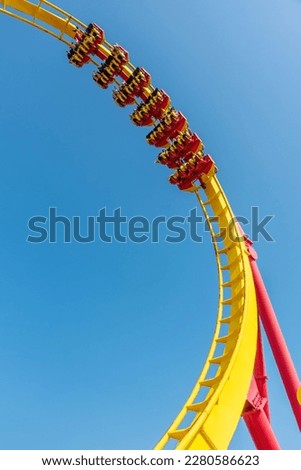 Roller coaster ride at theme park Royalty-Free Stock Photo #2280586623