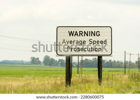 road sign or signage warning average speed prosecution for motorists or drivers to slow down or risk getting a traffic fine concept speed safety check in Gauteng, South Africa