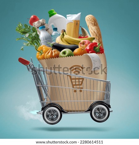 Fast turbo shopping cart delivering groceries, online grocery shopping and express delivery concept Royalty-Free Stock Photo #2280614511