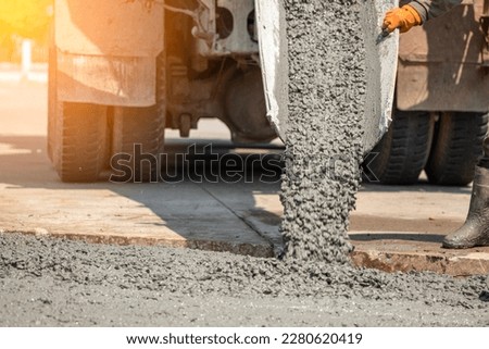 Pouring ready-mixed concrete after placing steel reinforcement to make the road by mixing in construction site	
 Royalty-Free Stock Photo #2280620419