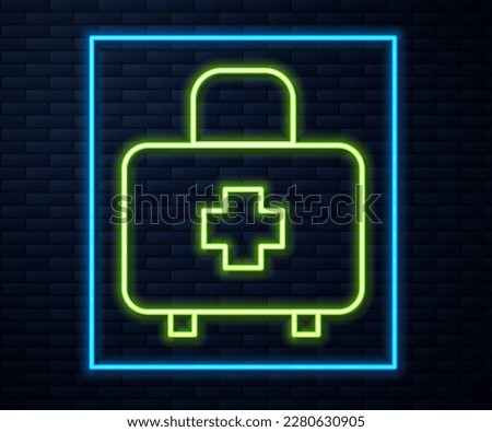 Glowing neon line First aid kit icon isolated on brick wall background. Medical box with cross. Medical equipment for emergency. Healthcare concept.  Vector