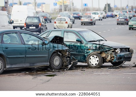 car crash accident on street, damaged automobiles after collision in city Royalty-Free Stock Photo #228064051