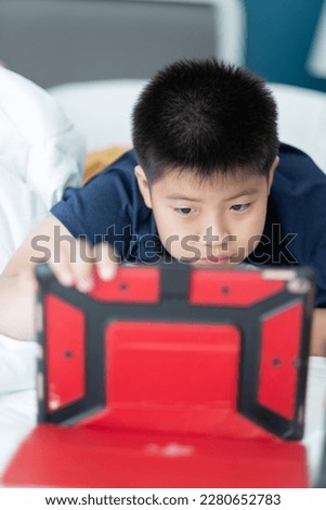 chinese child addicted phone, asian girl playing smartphone, kid watching cartoon

