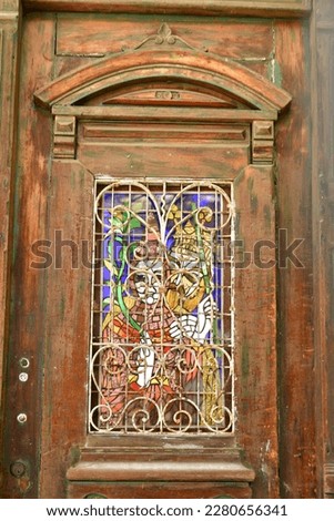 Old wooden door with colorfull glas window Valparaiso Chile. High quality photo