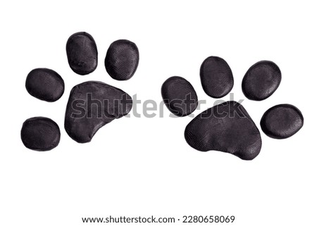 Cat paw prints or footprints plasticine icon isolated on white background Royalty-Free Stock Photo #2280658069