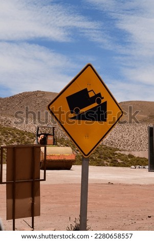 Truck road sign steep track in desert of chile. High quality photo