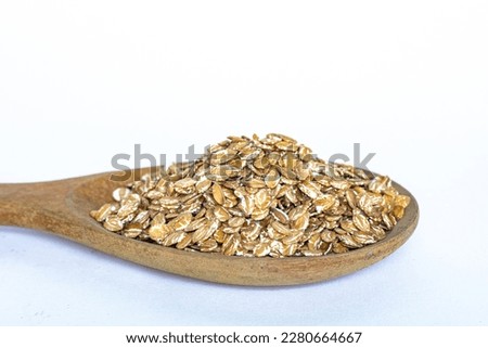 Oatmeal, healthy food on spoon, isolate white background 
