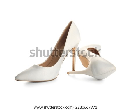 Pair of high heeled shoes on white background Royalty-Free Stock Photo #2280667971