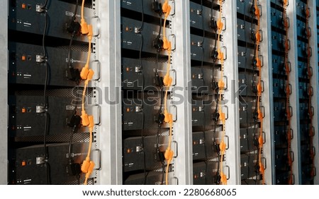 Image of a battery energy storage system consisting of several lithium battery modules placed side by side. This system is used to store renewable energy and then use it when needed. Royalty-Free Stock Photo #2280668065