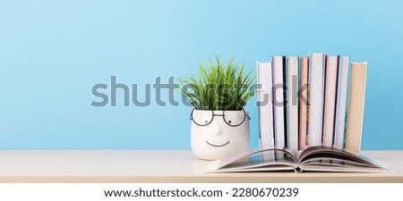 Old books on a table, with one book open and copy space for your text Royalty-Free Stock Photo #2280670239