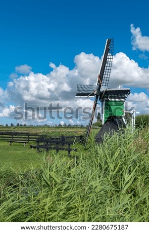 Historic windmill De Hadel in the Zaanse Schans open-air museum in Zaandam. Province of North Holland in the Netherlands Royalty-Free Stock Photo #2280675187