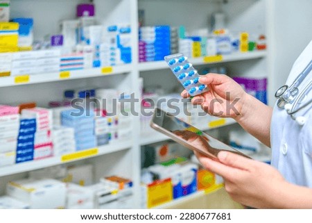 Pharmacist holding mobile phone using for filling prescription in pharmacy drugstore	 Royalty-Free Stock Photo #2280677681