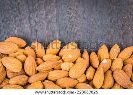 Almond on wooden background - vintage old effect stlye pictures