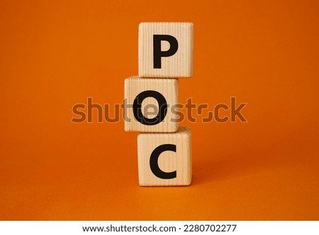 POC - Proof of Concept symbol. Wooden cubes with words POC. Beautiful orange background. Business and POC concept. Copy space.