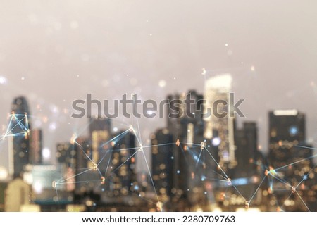 Double exposure of abstract virtual technology hologram on blurry cityscape background. Research and development software concept
