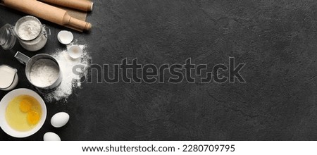 Different ingredients for baking on dark background with space for text Royalty-Free Stock Photo #2280709795