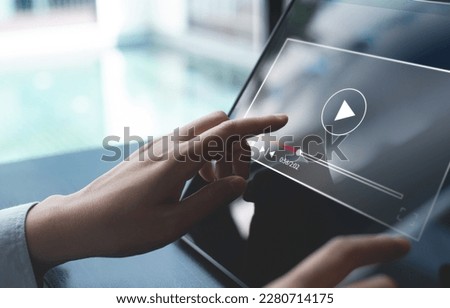 Video marketing concept. Woman playing video content online streaming, running short clip on digital tablet. Marketing technology and advertising for  online business, internet network