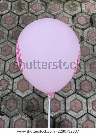 A cute pink balloon for a birthday party