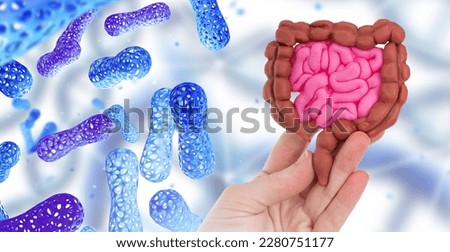 Probiotics near intestines. Human hand with intestinal tract. Microbiome of digestion. Probiotic cells around gut. Concern for quality of digestion. Study of intestinal microflora. Probiotic medicine Royalty-Free Stock Photo #2280751177