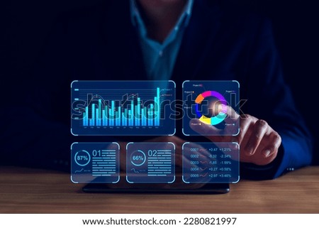 Data analyst working on business analytics dashboard with charts, metrics and KPI to analyze performance and create insight reports and strategic decisions for operations management on virtual screen. Royalty-Free Stock Photo #2280821997