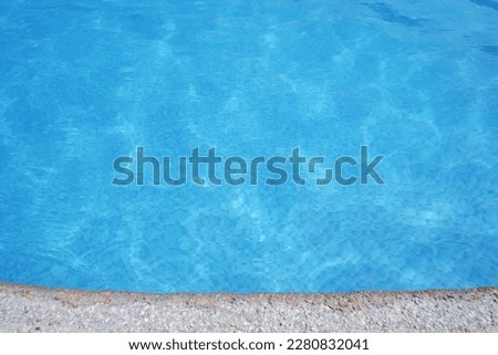 Blue Water surface. Blue ripped water in swimming pool.
summer concept blue water elements.