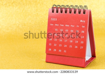 Red May 2023 Monthly desk calendar for 2023 year on golden color background. Royalty-Free Stock Photo #2280833139