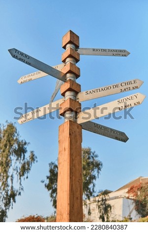 Signpost to the world, World travel signpost, directions signpost with distance to countries