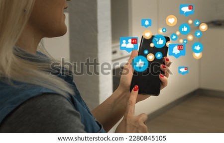 Close-up of smartphone in female hands. In foreground are virtual icons with picture of clouds, people and digital gadgets. Social media. Girl blogging, chatting online. Cloud technology.