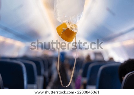 oxygen mask drop from the ceiling compartment on airplane	
 Royalty-Free Stock Photo #2280845361