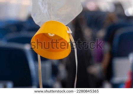 oxygen mask drop from the ceiling compartment on airplane	
 Royalty-Free Stock Photo #2280845365