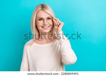 Photo of good mood lady blonde hair wear shirt touch eyeglasses smiling good vision correction intelligent person isolated on cyan color background