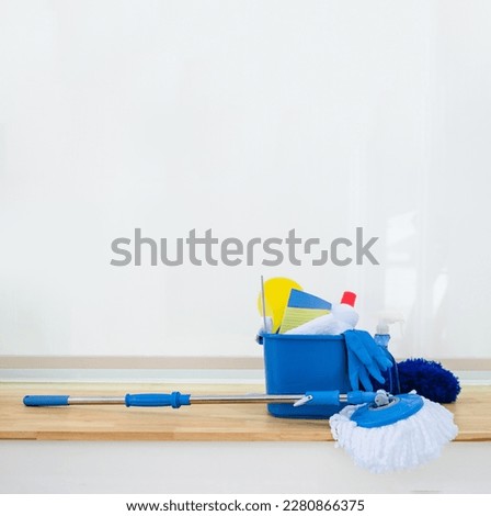 Cleaning set for different surfaces in kitchen, bathroom and other rooms. Empty place for text or logo on White background. Cleaning service concept. Early spring regular clean up. Front view.