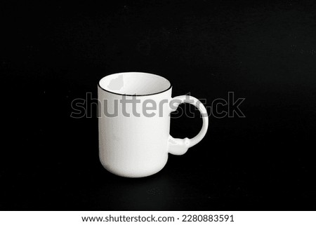 White mug. White cup with red heart for tea or coffee on background.

