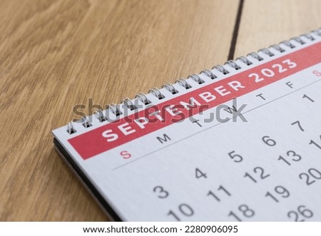 Closeup shot of a 2023 calendar, "September page". Selective focus shot of a calendar, focused on "September, 2023". Royalty-Free Stock Photo #2280906095