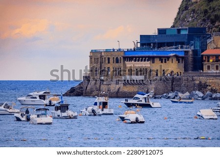 Sunset view of La Concha bay and beach in San Sebastian Donostia with the city coastline and waterfront hotels in the Basque Country, Spain