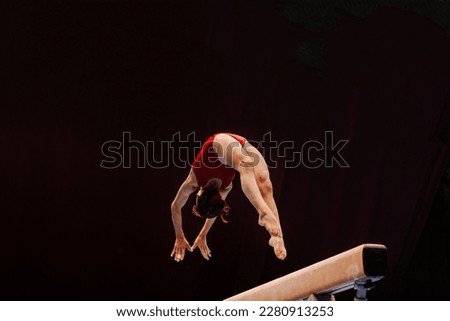 female gymnast athlete exercise on balance beam gymnastics, sports summer games  Royalty-Free Stock Photo #2280913253
