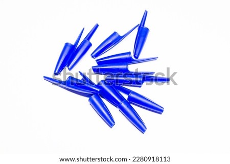 caps from ballpoint pens on a white isolated background