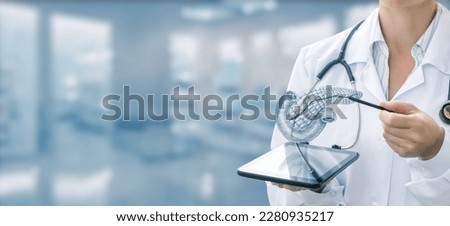 Doctor showing pancreas on tablet and blurred background. Royalty-Free Stock Photo #2280935217