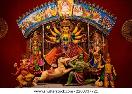 Idol of Goddess Devi Durga at a decorated puja pandal in Kolkata, West Bengal, India. Durga Puja is a famous and major religious festival of Hinduism that is celebrated throughout the world. Royalty-Free Stock Photo #2280937721