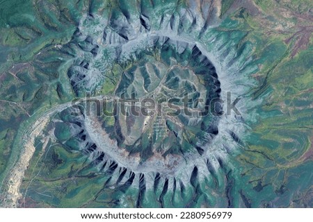 Kondyor Massif, giant crater, looking down aerial view from above, bird’s eye view platinum mine Kondyor Massif, Khabarovsk Krai, Russia