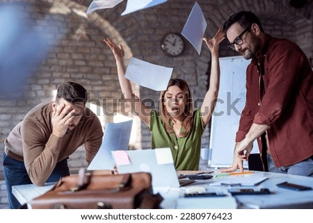 Stressful situation in office, business people working and receiving bad news Royalty-Free Stock Photo #2280976423