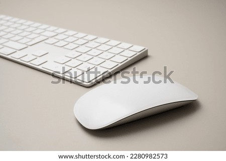 Workplace with mouse in foreground and keyboard blurred in background