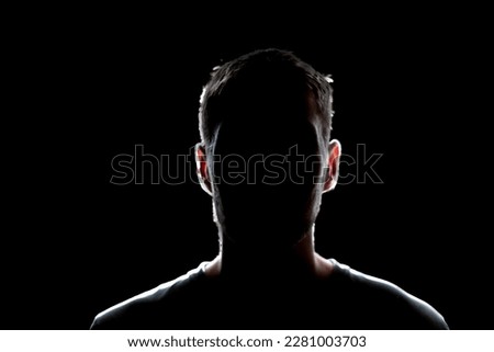 dark backlight shadow silhouette of male person, incognito unknown profile Royalty-Free Stock Photo #2281003703