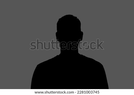 dark backlight shadow silhouette of male person, incognito unknown profile Royalty-Free Stock Photo #2281003745