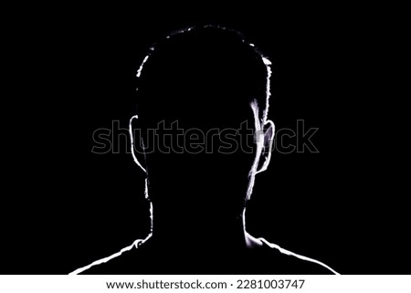 dark backlight shadow silhouette of male person, incognito unknown profile Royalty-Free Stock Photo #2281003747