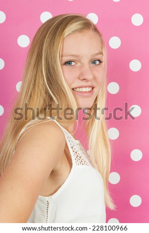 Studio portrait blond teen girl 