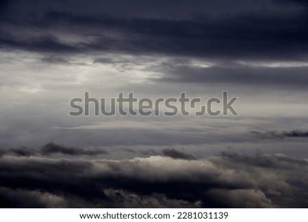 Dark clouds in the sky by plane Royalty-Free Stock Photo #2281031139