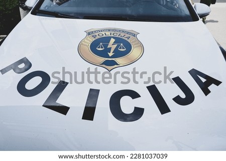 Police car on the street. Front view of a police car with the lettering "Police".  Police patrol car in Sarajevo, Bosnia and Herzegovina.
