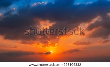 Bright colorful sunset on the sea with beautiful clouds